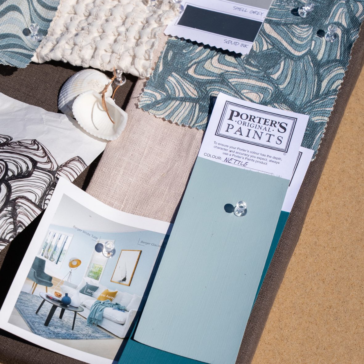 Mood board for the Frenchmans Shells linen cushion cover with fabric swatches, shells and blue-green paint samples.