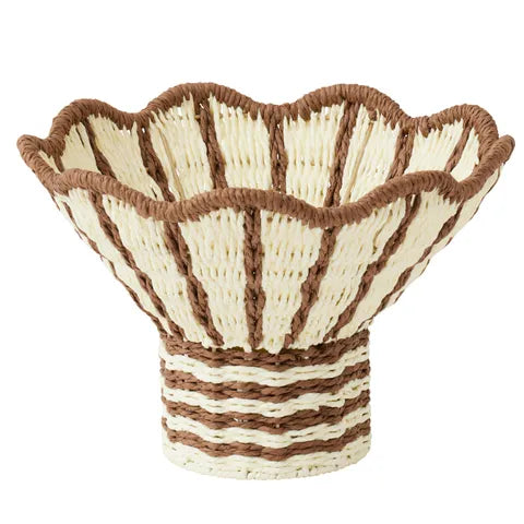 Woven basket with brown and beige pattern on a white background