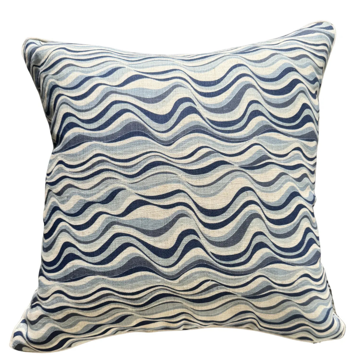 Pacific Straddie Stripe square linen cushion cover in blue wave print on a natural background