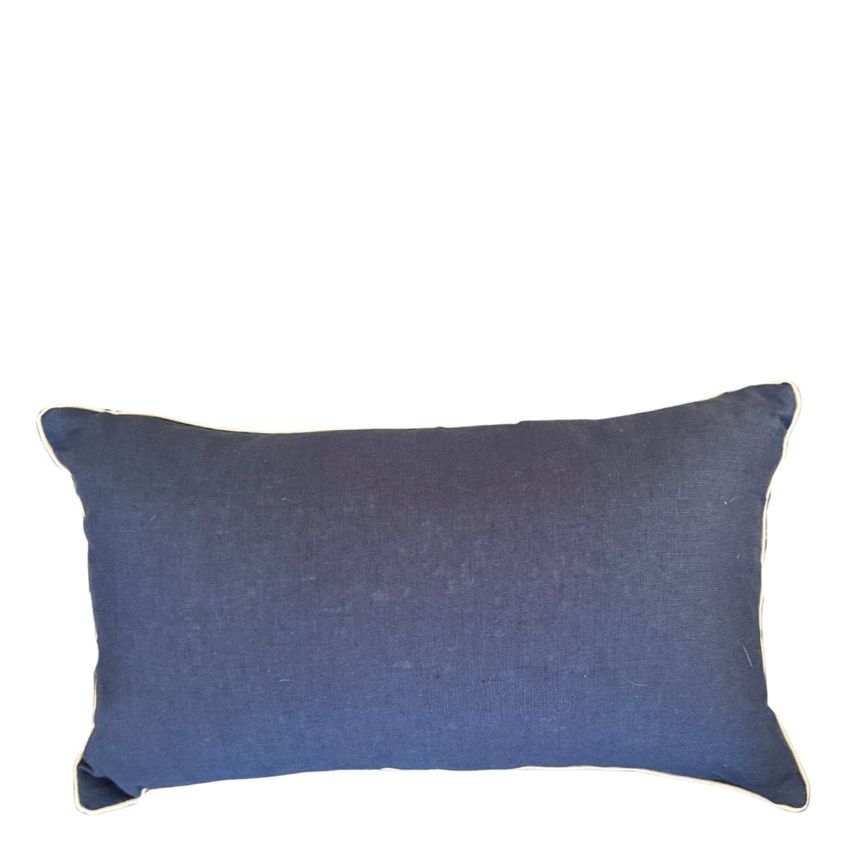Navy linen reverse of rectangular Pacific Shells cushion cover with natural piping