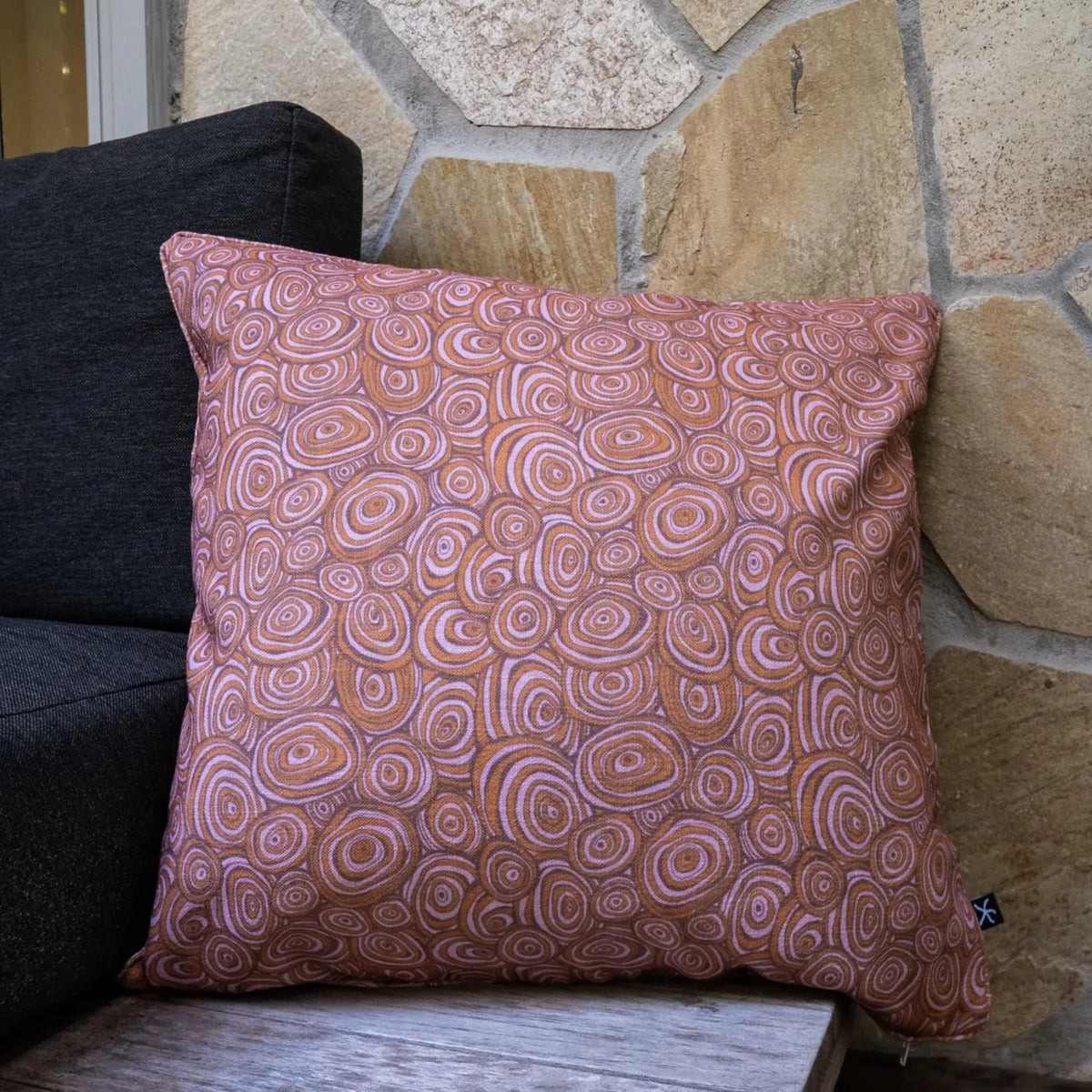 Square outdoor and indoor cushion in the Claytons colourway featuring the Growth Rings pattern.
