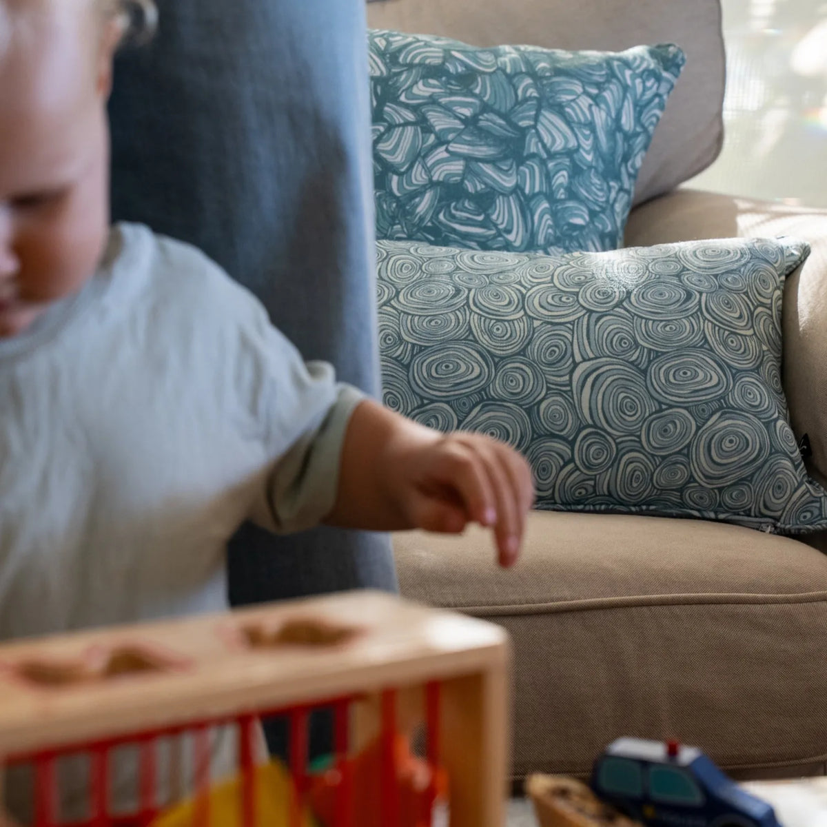 Lifestyle image of a child in the foreground with Frenchmans colourway Pipi and Growth Rings